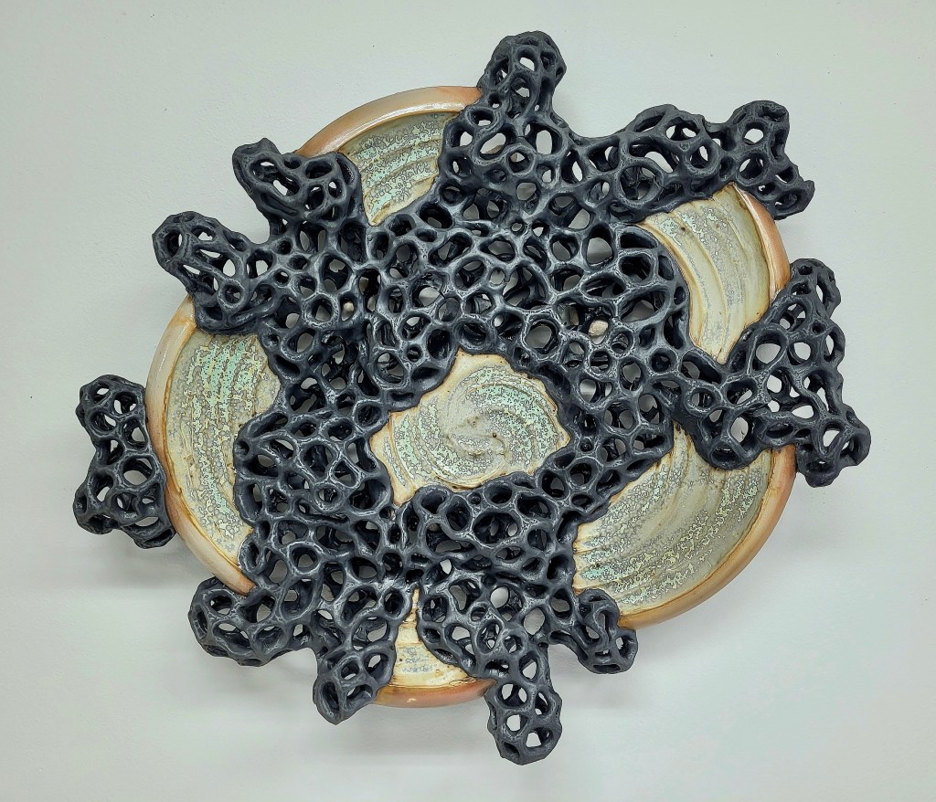 wall-mounted ceramic sculpture